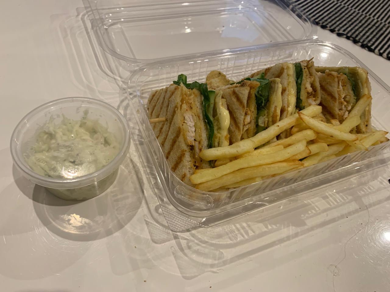 Karachi Flavours club sandwich with fries and slaw